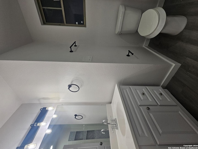 bathroom featuring toilet and a textured ceiling