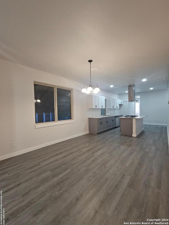 interior space with sink, a chandelier, and dark wood-type flooring