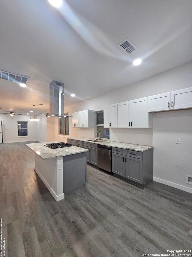 kitchen with dishwasher, island range hood, a center island, gas stovetop, and white cabinetry