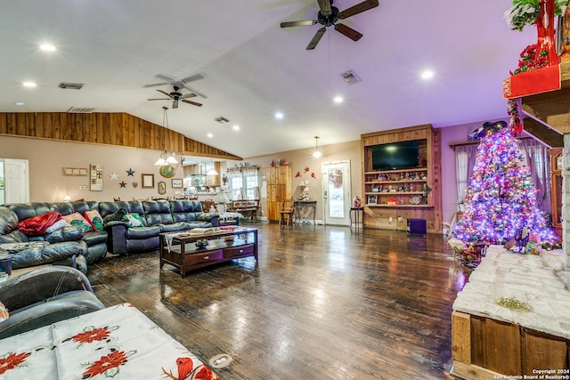 living room featuring vaulted ceiling, ceiling fan, and dark wood-type flooring