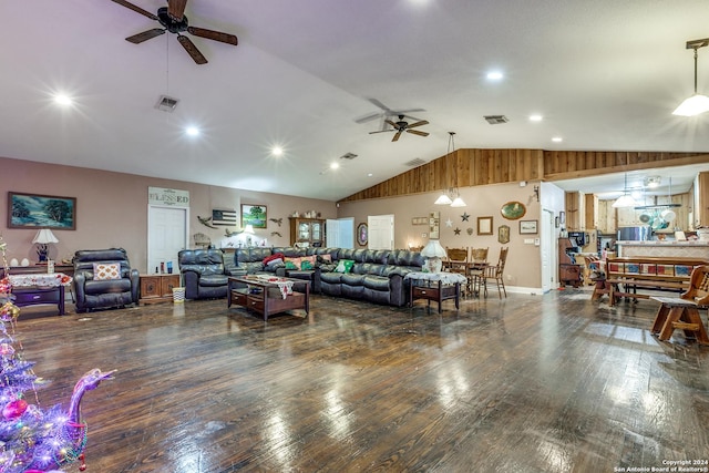 living room with ceiling fan, lofted ceiling, and dark wood-type flooring