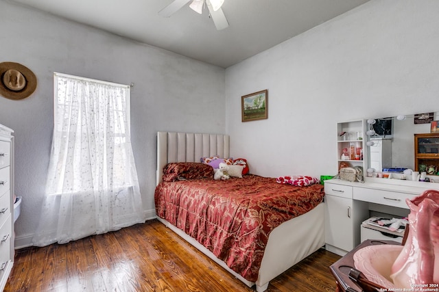 bedroom with ceiling fan and dark hardwood / wood-style floors