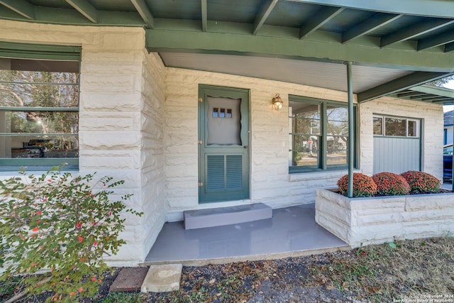 entrance to property with covered porch