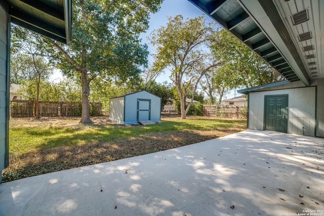 view of patio with a shed