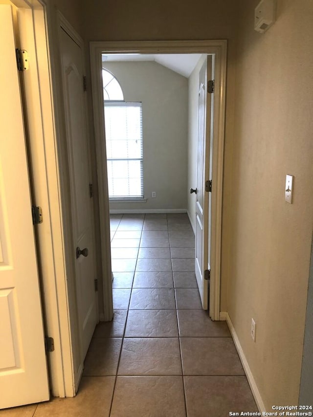 hall featuring tile patterned flooring