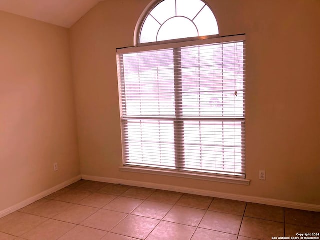 unfurnished room featuring light tile patterned floors and a healthy amount of sunlight