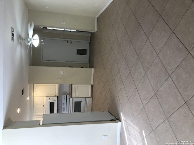 kitchen featuring tile walls