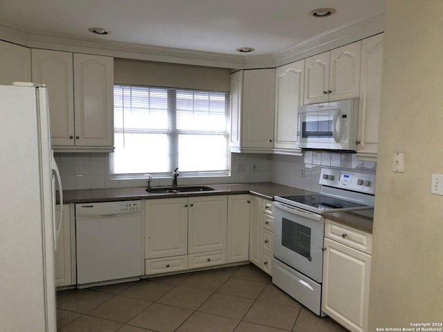 kitchen with white cabinetry, sink, tile patterned flooring, backsplash, and white appliances