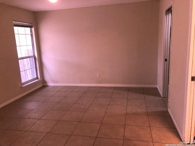 view of tiled spare room