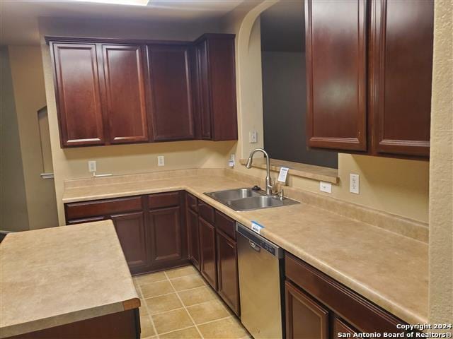 kitchen with dishwasher, light tile patterned flooring, and sink