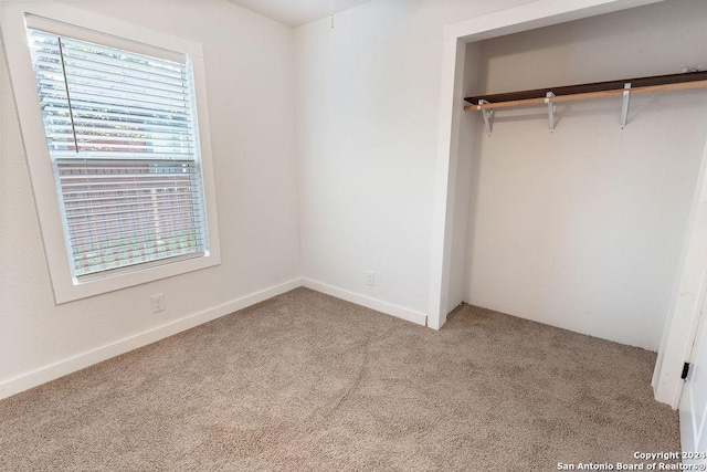 unfurnished bedroom with light carpet