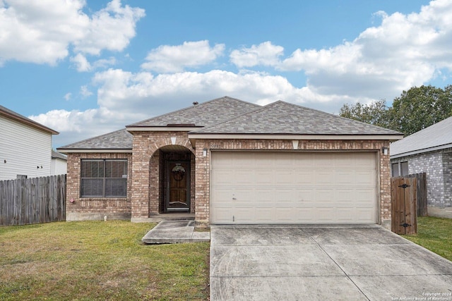 view of front facade featuring a front lawn and a garage