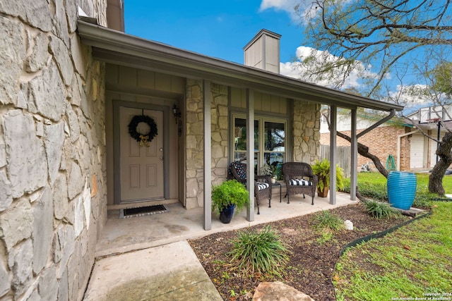 entrance to property featuring covered porch