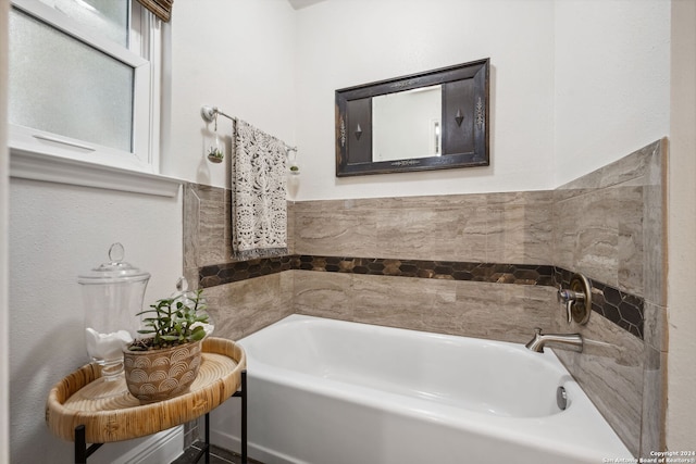 bathroom with a tub to relax in