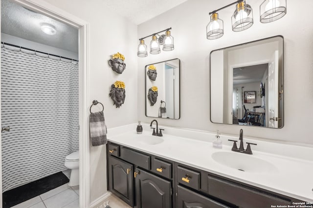 bathroom with walk in shower, tile patterned flooring, a textured ceiling, toilet, and vanity