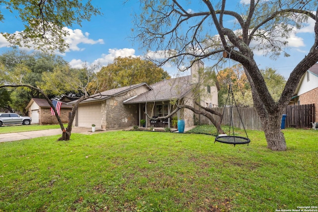 view of front facade with a garage and a front lawn