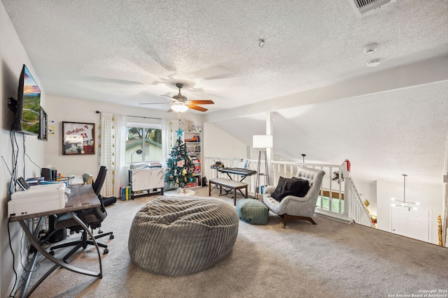 carpeted office space with ceiling fan and a textured ceiling