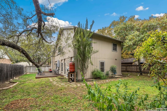 back of property featuring a yard