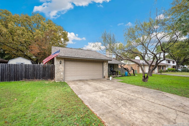 view of front of home featuring a garage and a front lawn