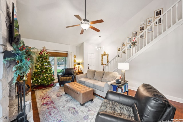 living room featuring ceiling fan, hardwood / wood-style floors, and high vaulted ceiling