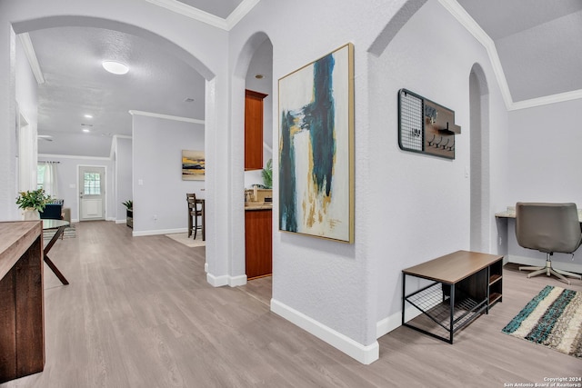 hall featuring crown molding and light hardwood / wood-style flooring