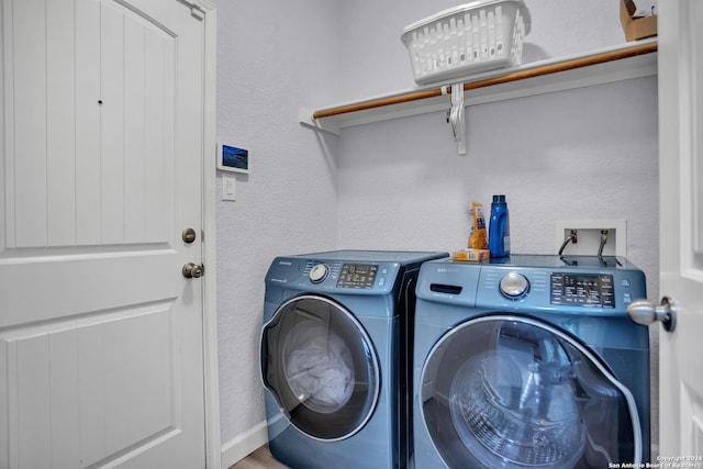 laundry room with washing machine and dryer