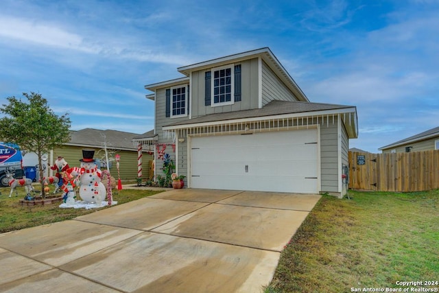 view of front of house with a garage and a front yard