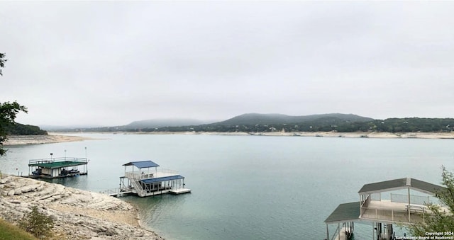694 Scenic Cir, Pipe Creek, TX 78063 - water view featuring a floating dock