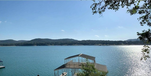 694 Scenic Cir, Pipe Creek, TX 78063 - water view with a mountain backdrop