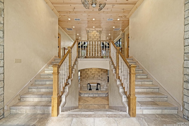 694 Scenic Cir, Pipe Creek, TX 78063 - stairs with wood ceiling, recessed lighting, a high ceiling, and stone tile floors