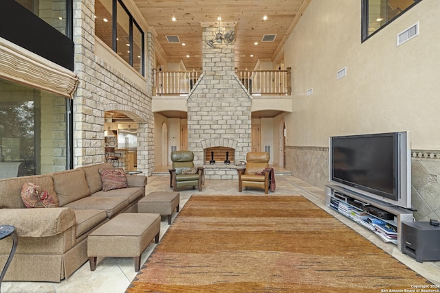 694 Scenic Cir, Pipe Creek, TX 78063 - living area featuring arched walkways, a towering ceiling, wood ceiling, recessed lighting, and stairway
