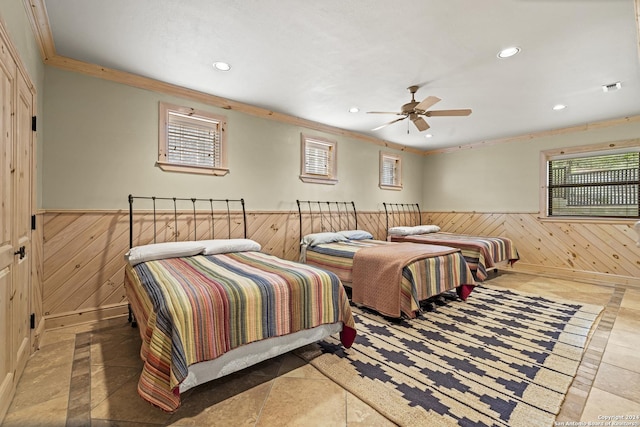 694 Scenic Cir, Pipe Creek, TX 78063 - bedroom featuring wainscoting, wooden walls, ornamental molding, recessed lighting, and a ceiling fan