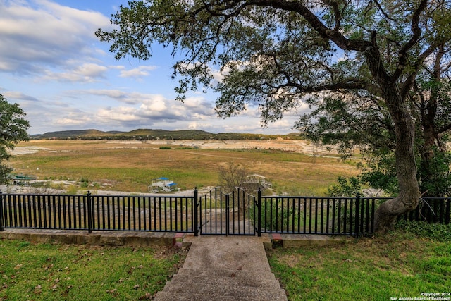 694 Scenic Cir, Pipe Creek, TX 78063 - view of yard with a gate and a rural view