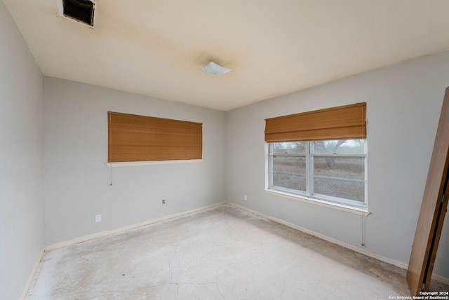 spare room with concrete flooring