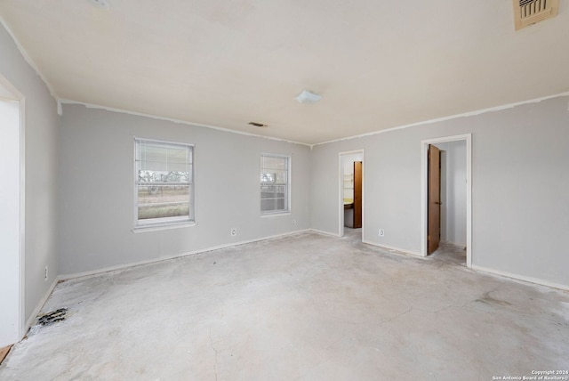 unfurnished room featuring ornamental molding