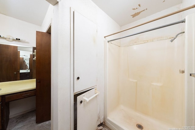 bathroom with vanity and walk in shower