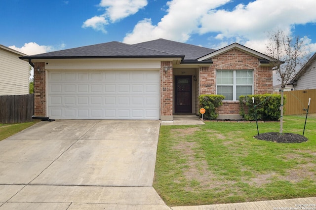 ranch-style home with a garage and a front yard