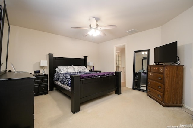 bedroom featuring light colored carpet and ceiling fan