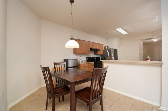 dining area with light tile patterned floors