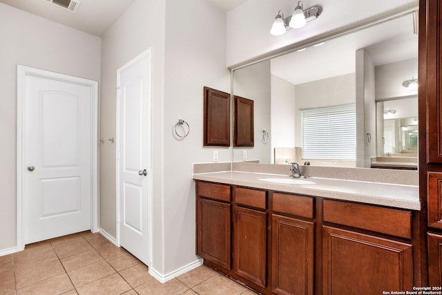 bathroom featuring tile patterned floors and vanity