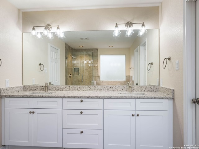 bathroom with vanity and an enclosed shower