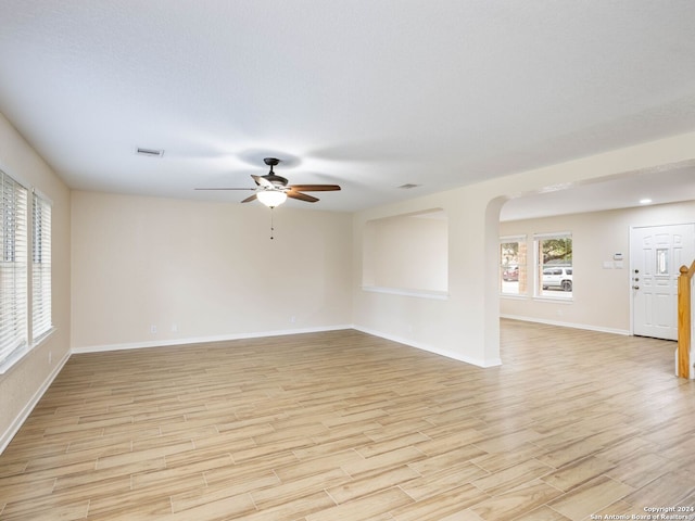 spare room with light hardwood / wood-style floors and ceiling fan