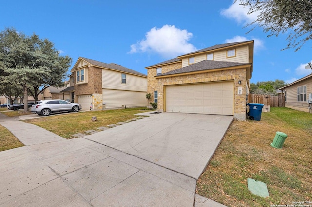 view of front of house with a garage and a front lawn