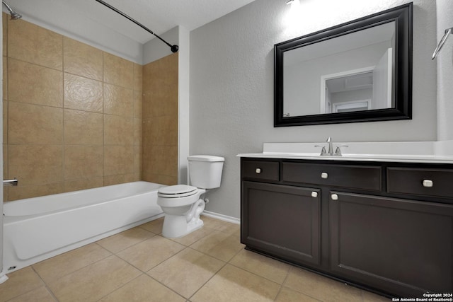 full bathroom with tile patterned flooring, a textured ceiling, toilet, vanity, and tiled shower / bath