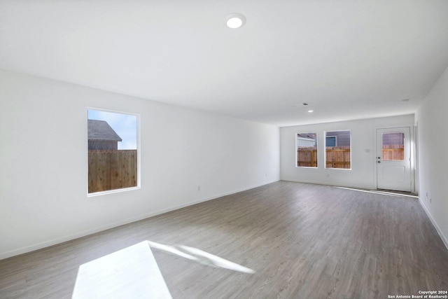 empty room with wood-type flooring