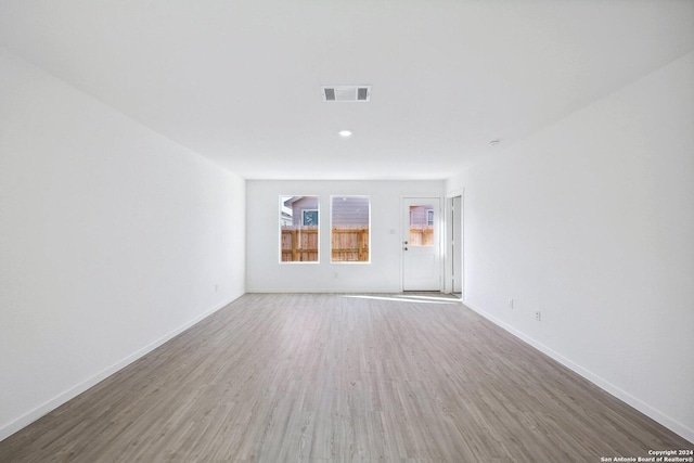 spare room with hardwood / wood-style flooring