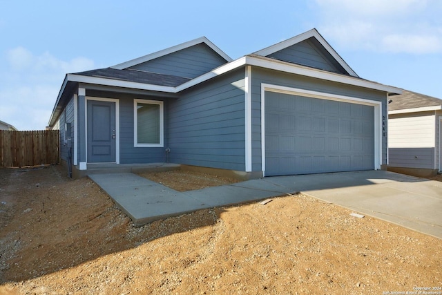 single story home with a garage