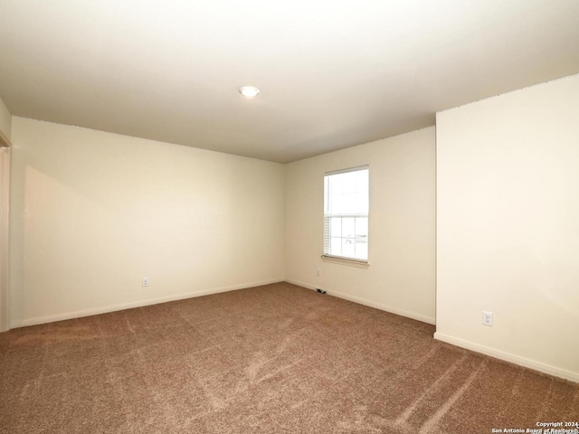 unfurnished room with carpet floors