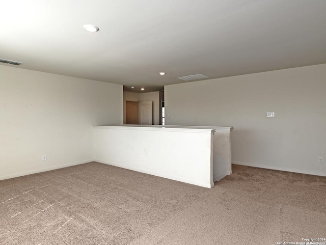 unfurnished room featuring carpet flooring