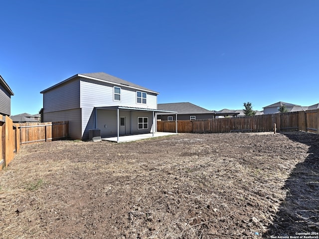 back of house with a patio area and cooling unit